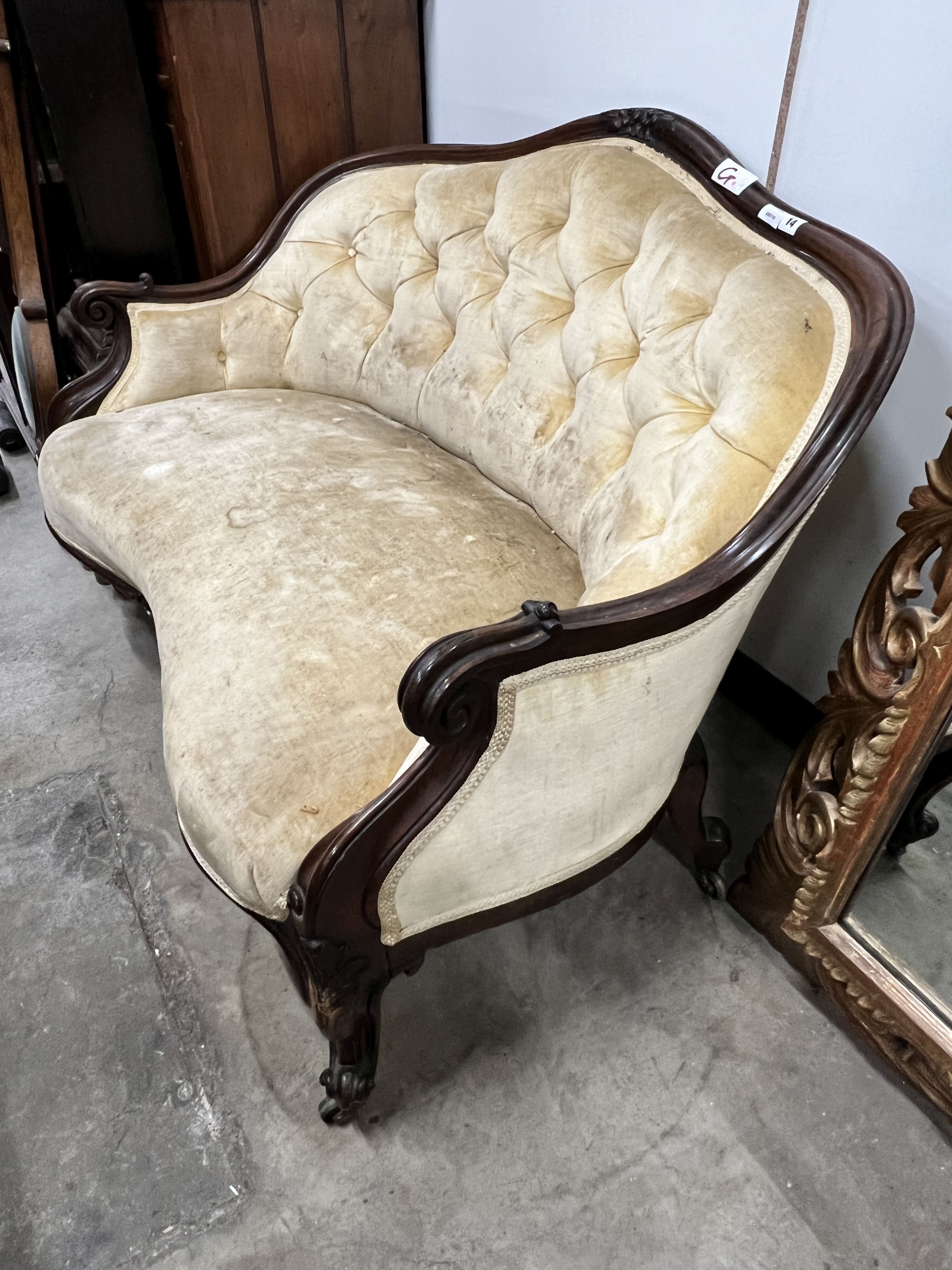 A Victorian rosewood buttonback upholstered settee, length 120cm, depth 80cm, height 84cm